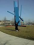 Joan and strange blue sculpture.